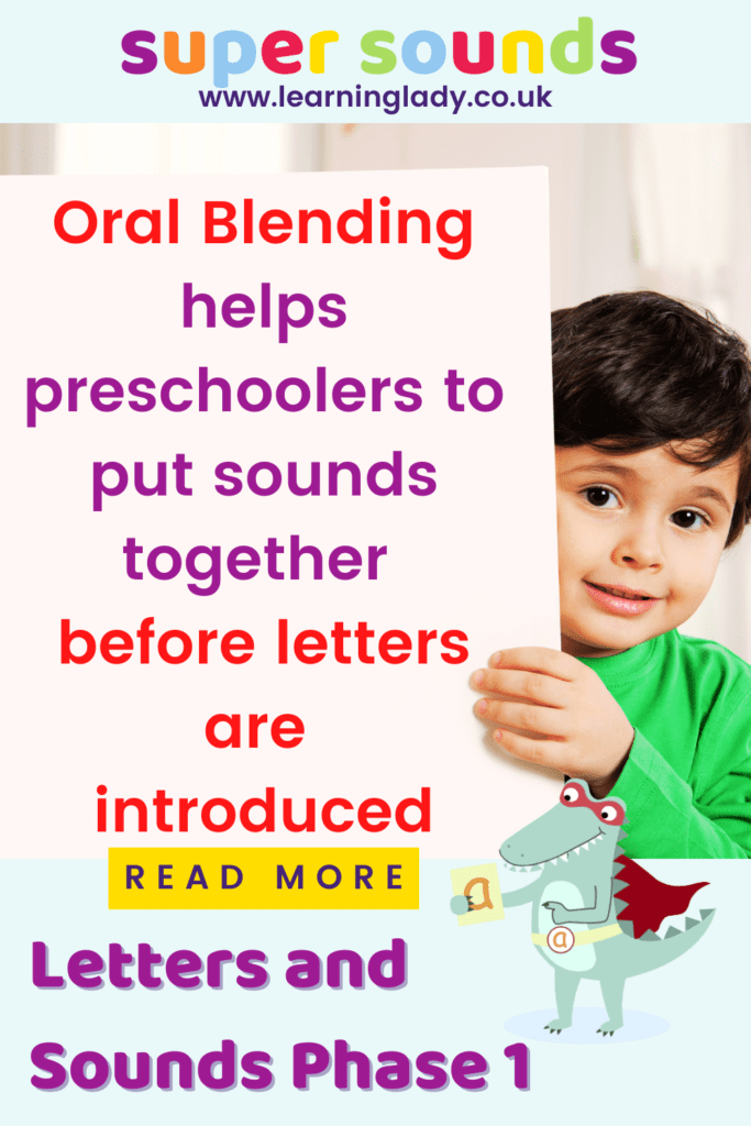 a preschool boy holds up a sign explaining that letters and sounds phase 1 expects oral blending to be taught before letters are introduced
