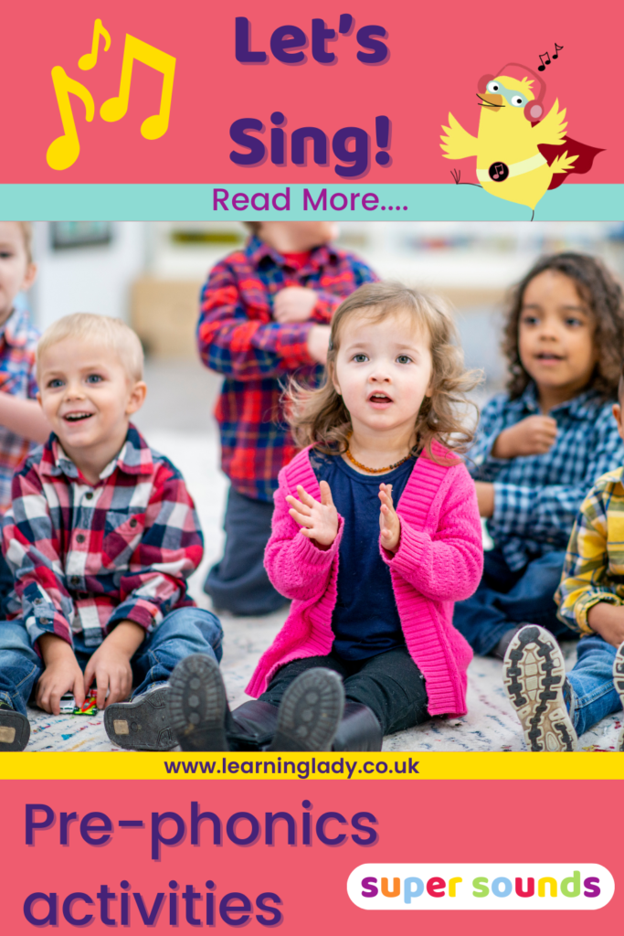 Preschool sit and clap as the sing along with their teacher during preschool phonics song activities