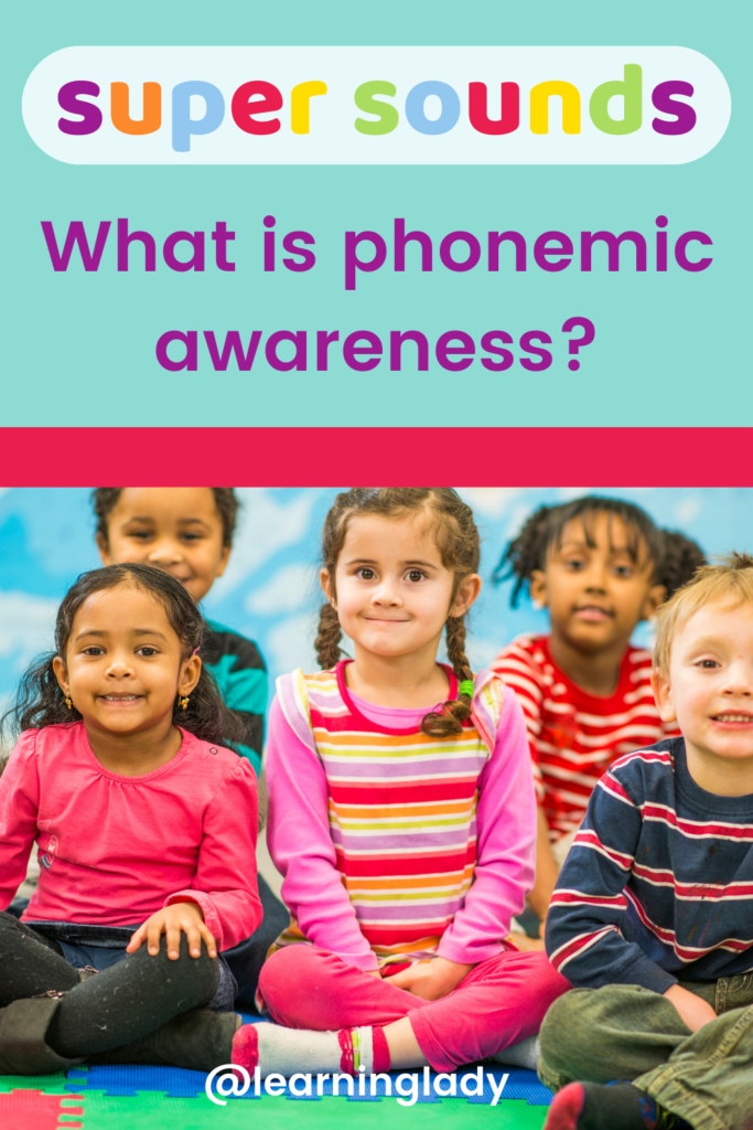 Preschool children gathered to tale part in a phonemic awareness activity on the carpet in nursery.